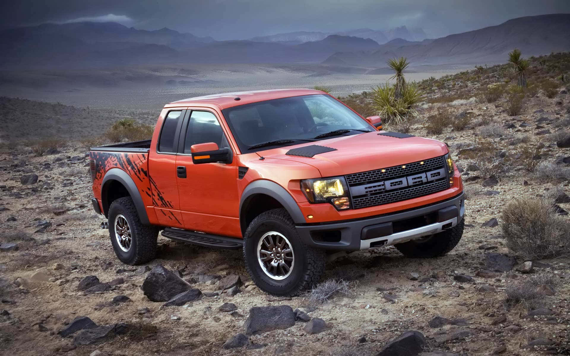 The Ford F - 150 Raptor Is Parked In The Desert