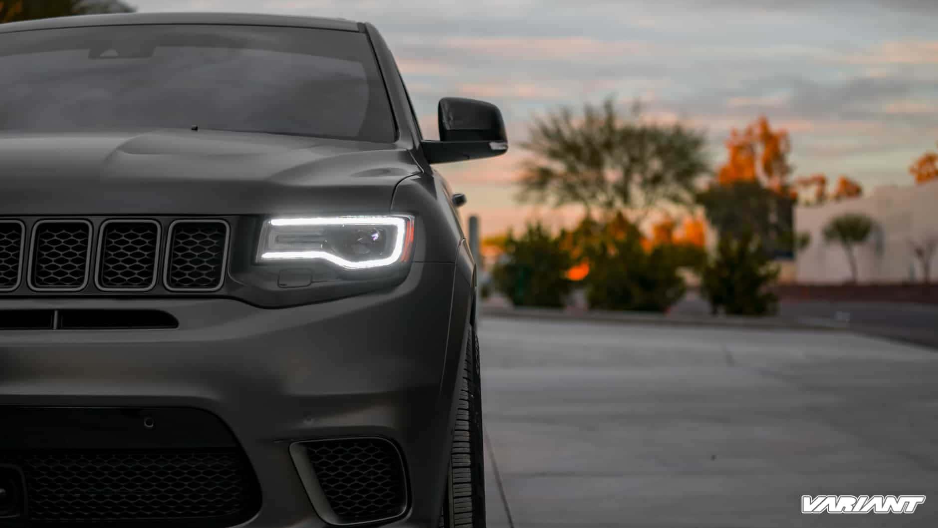 The Front End Of A Black Jeep Grand Cherokee