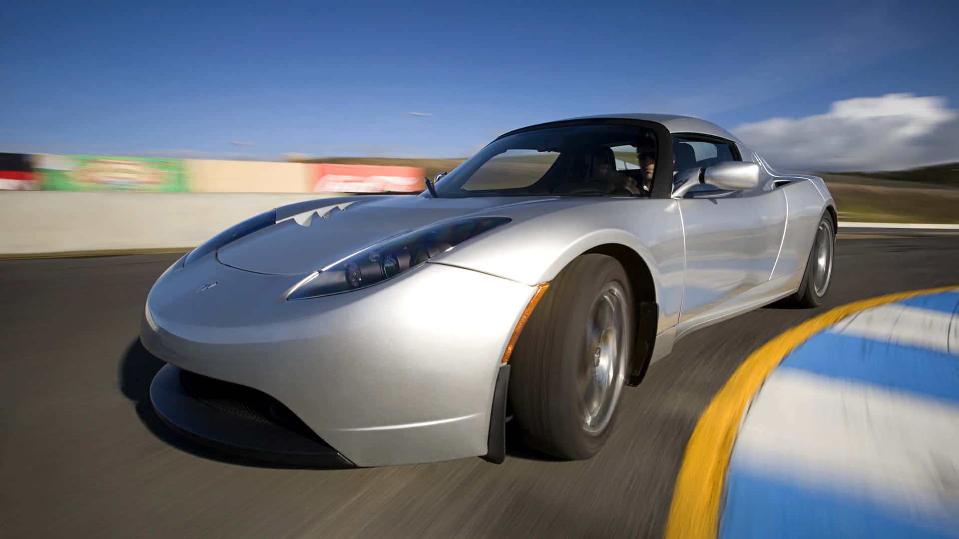 The Futuristic Tesla Roadster On A Riding Spree Background