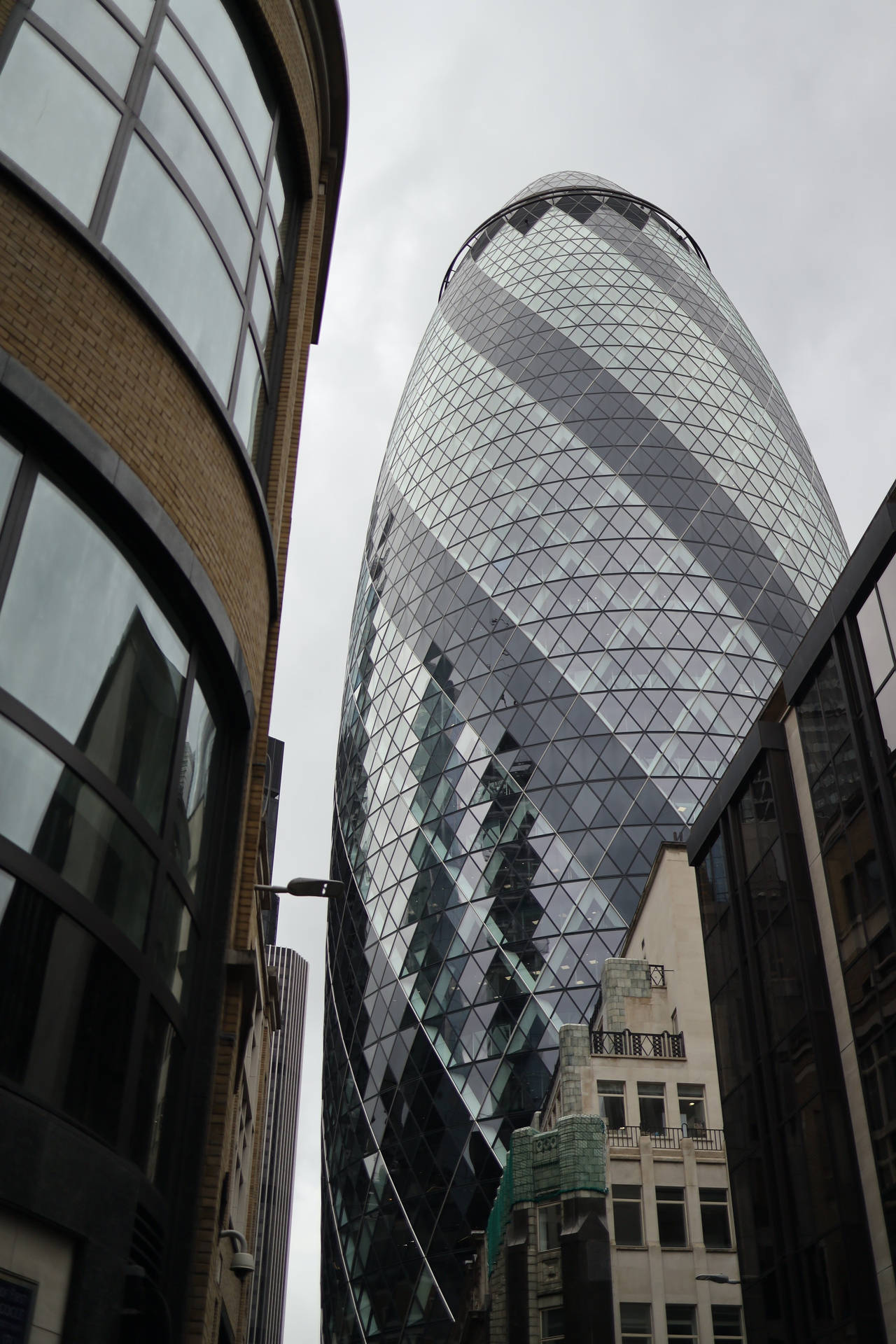 The Gherkin And Nearby Building Background