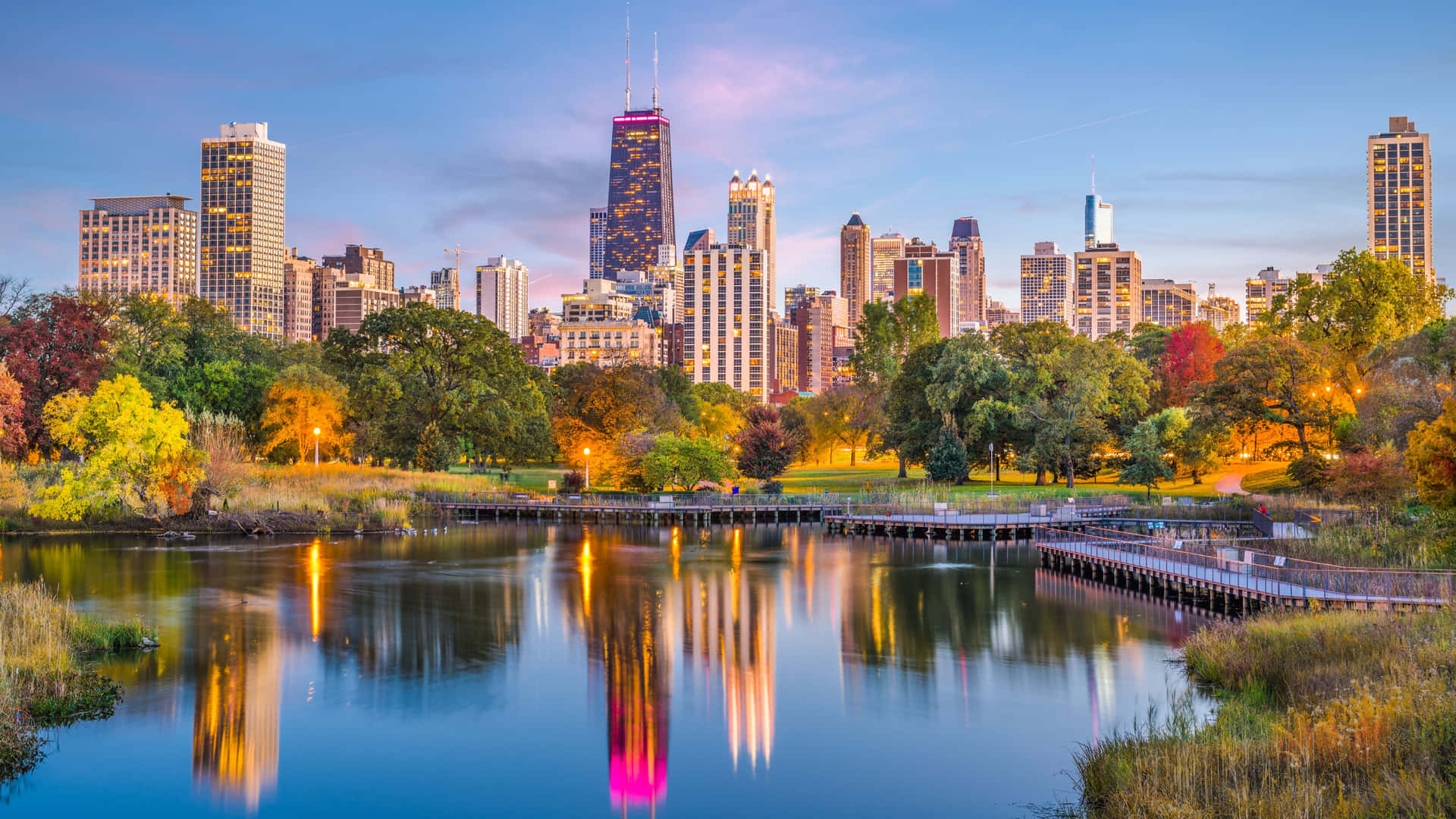 The Glimmering Lights Of The Chicago Skyline, Reflecting In The Waters Of Lake Michigan. Background