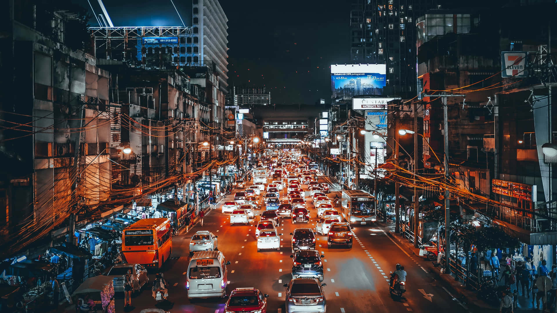 The Glittering Lights Of A Busy City Street At Night