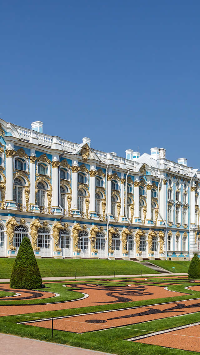 The Glorious Catherine Palace Nestled In Verdant Greenery Background