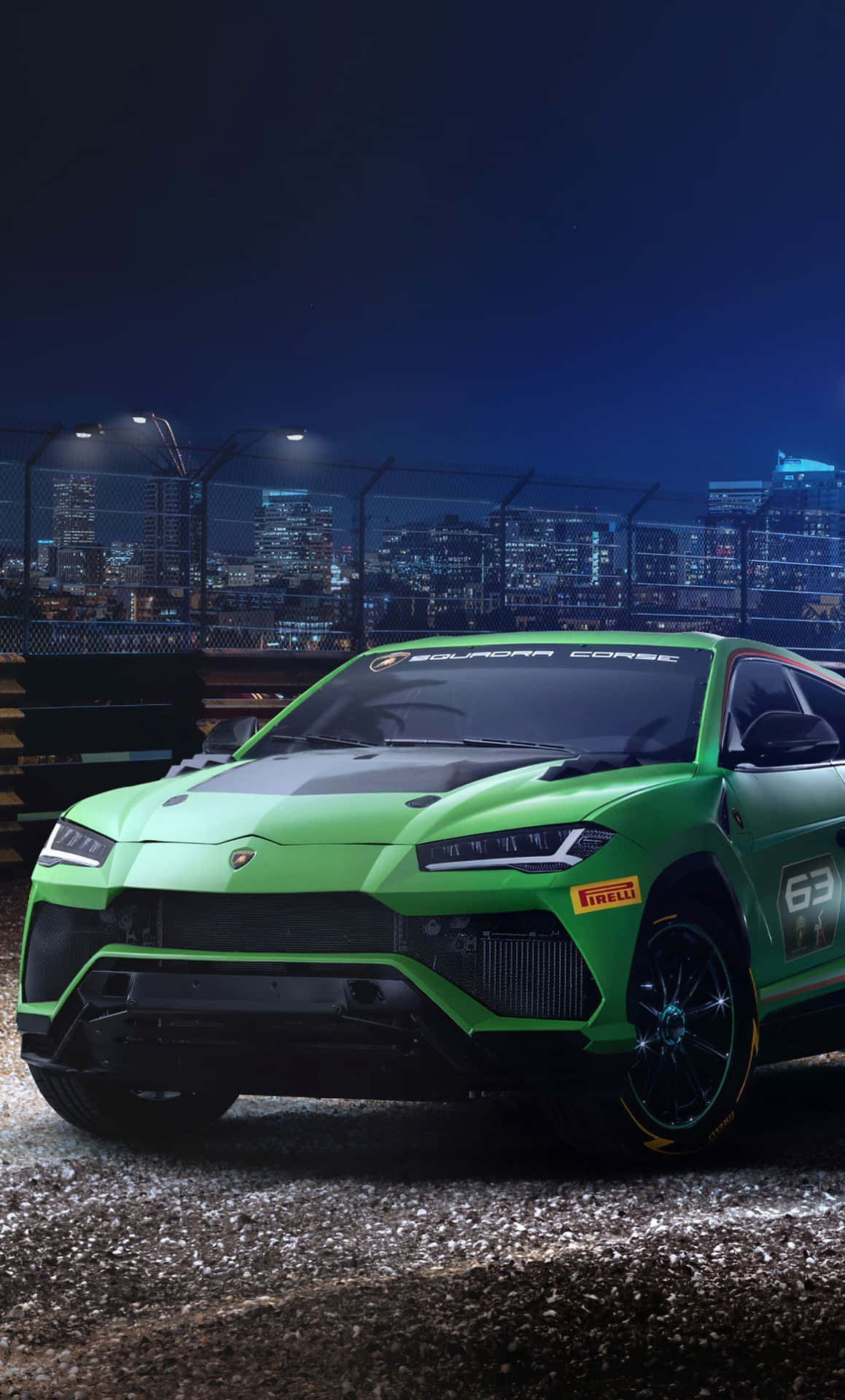The Green Lamborghini Urus Is Driving Down The Street At Night Background
