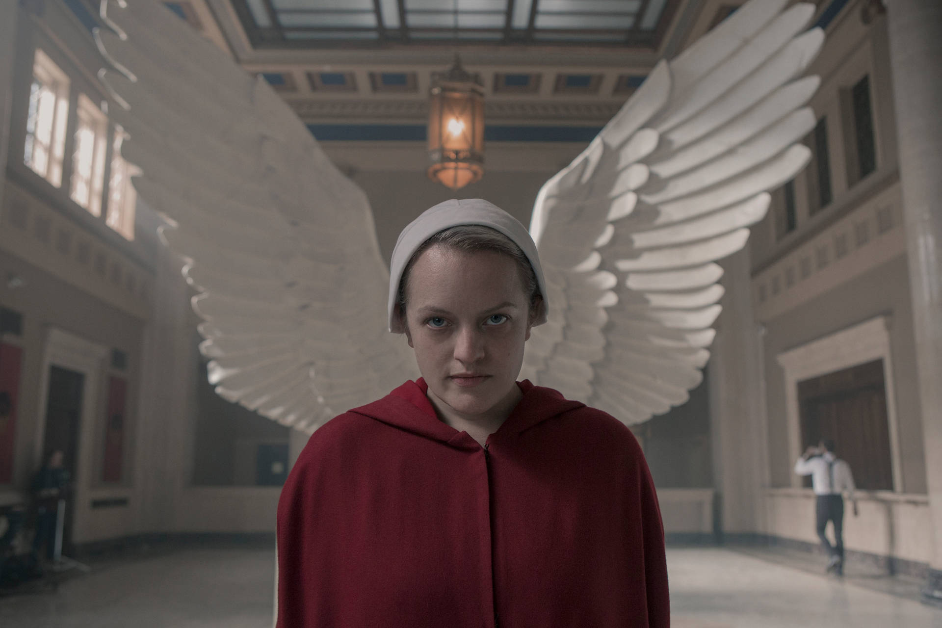 The Handmaid's Tale June Against Statue Of Wings