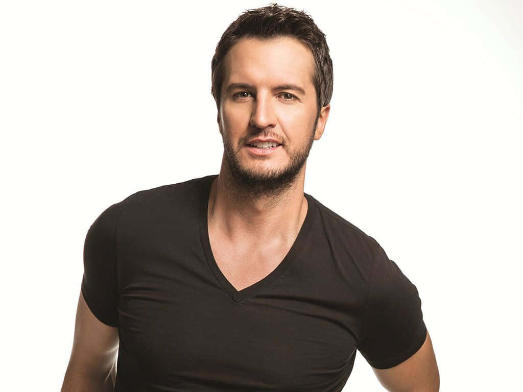 The Iconic Country Singer, Luke Bryan, Playing Guitar In A Live Performance. Background