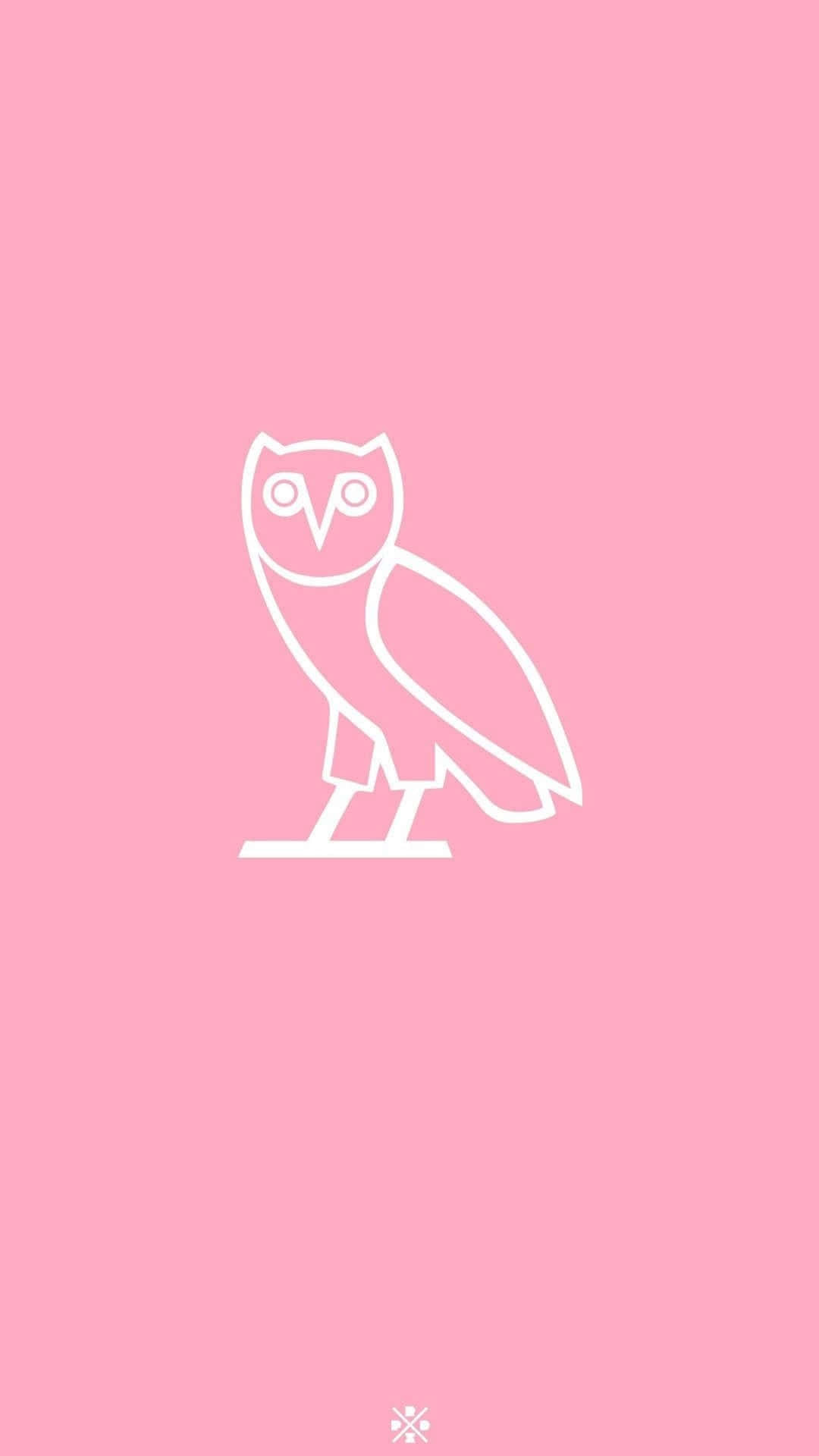 The Iconic Drake Ovo Owl Lights Up On An Apple Iphone 8. Background