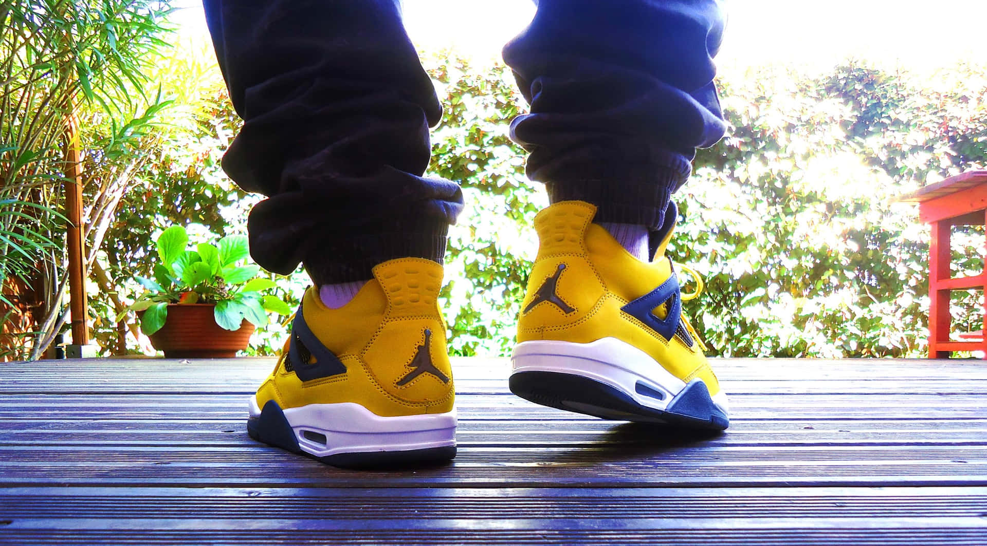 The Iconic Jumpman Logo, Emblazoned In Bold And Bright Yellow Background