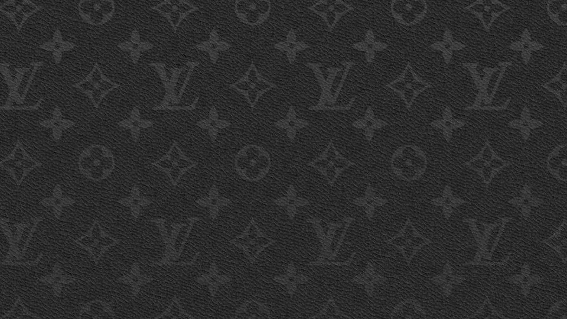 The Iconic Louis Vuitton Logo Atop A Brown Desktop Background