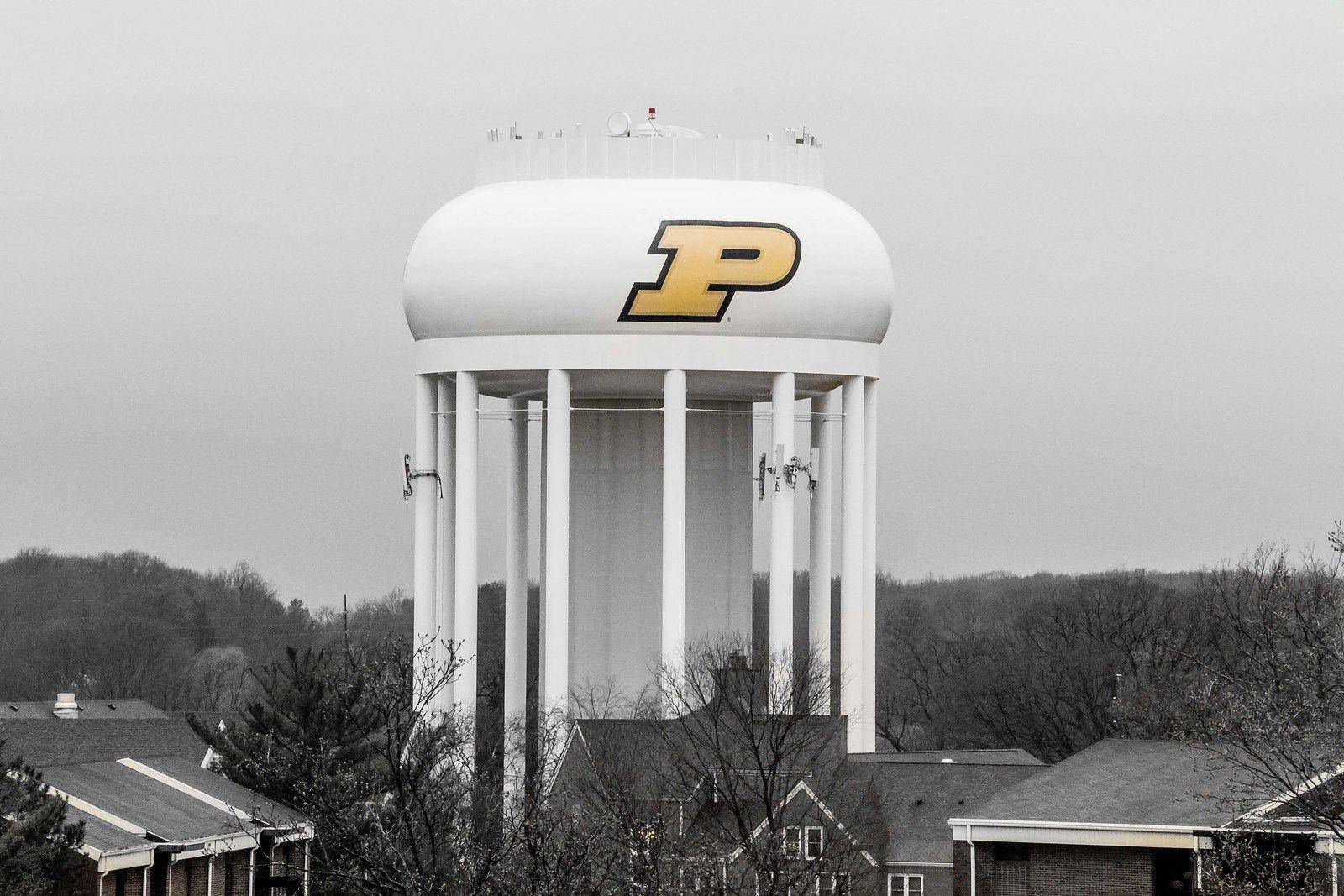 The Iconic Purdue University Water Tower At Dusk. Background