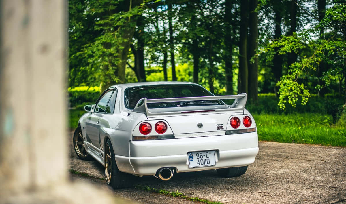 The Iconic R33 Gtr Manufactured By Nissan Background