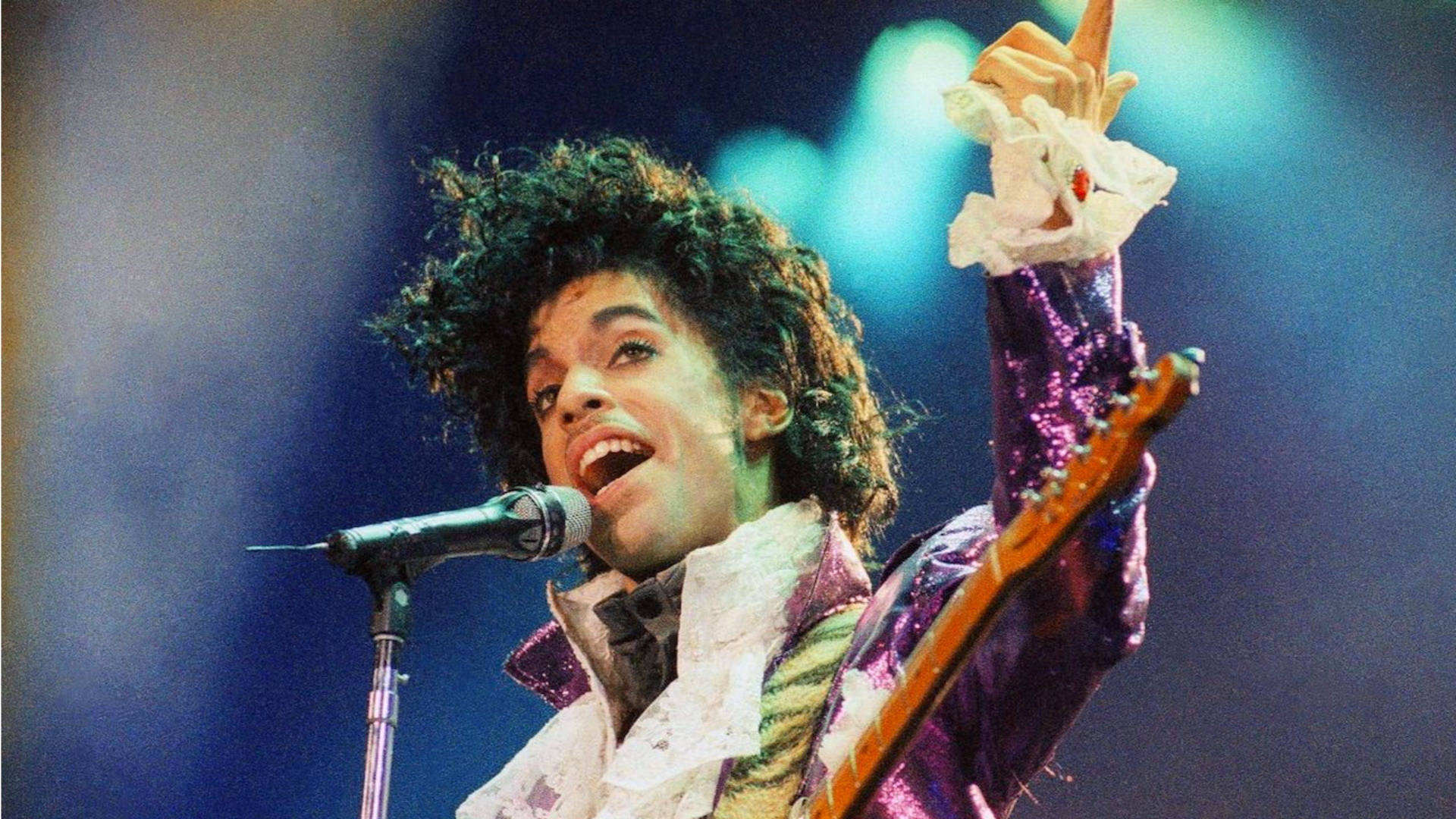 The Iconic Singer, Prince Playing A Guitar On Stage
