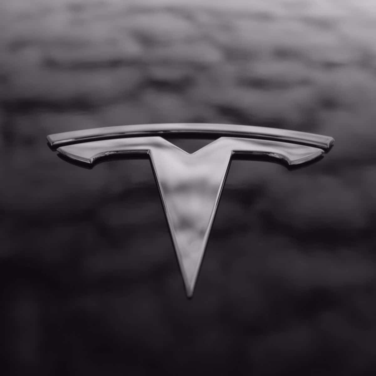 The Iconic Tesla Logo In 4k Background