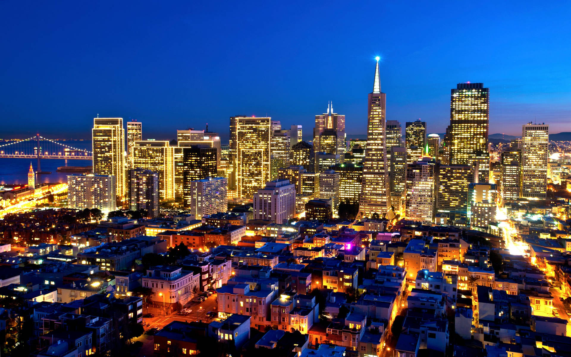 The Illuminating Glow Of Coit Tower Background