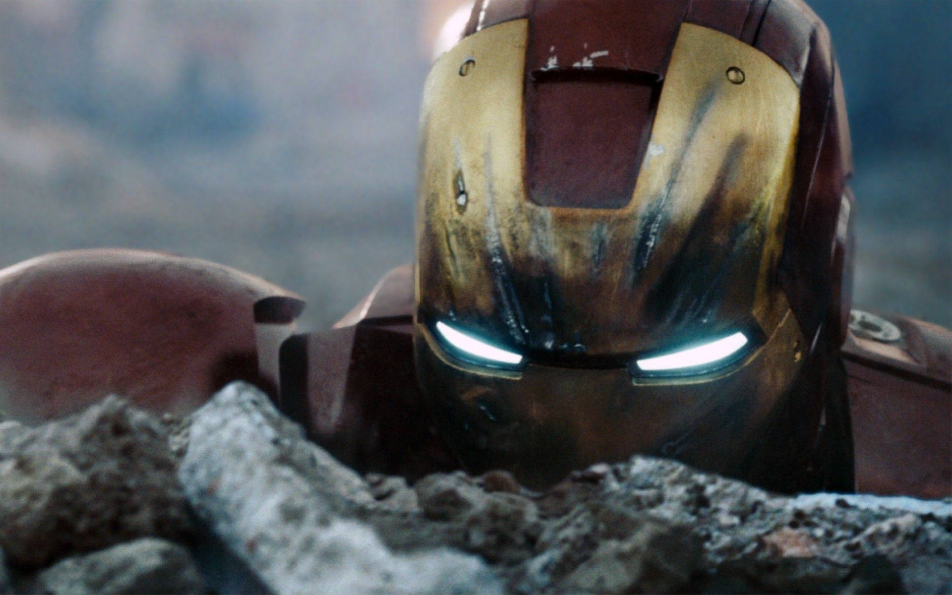 The Iron Man Mark 3 Helmet Showcasing Its Signature Gold Arc Reactor Background