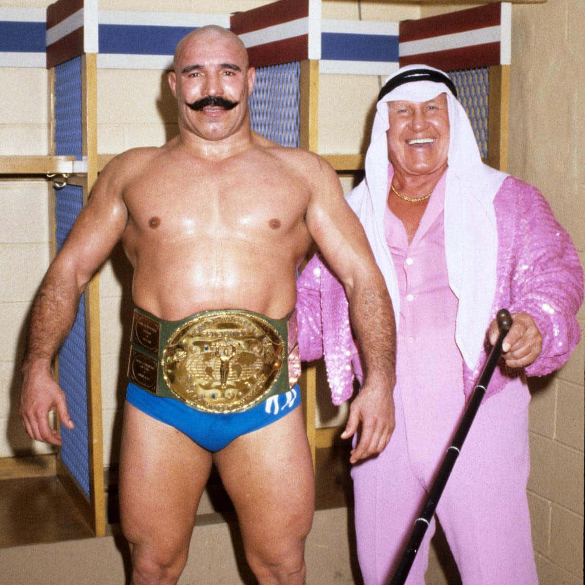 The Iron Sheik With Freddie Blassie In Wrestling Match Background