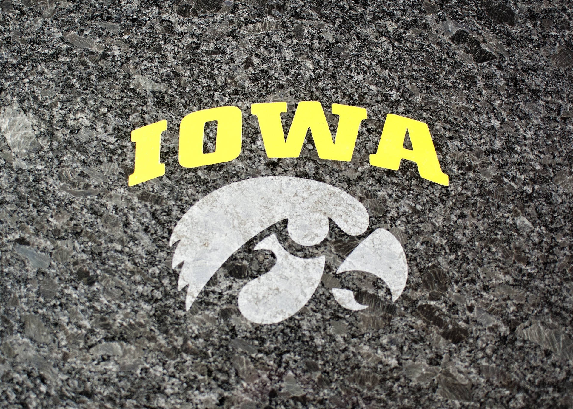 The Irresistible Strength Of The Iowa Hawkeyes Captured In A Striking Image.