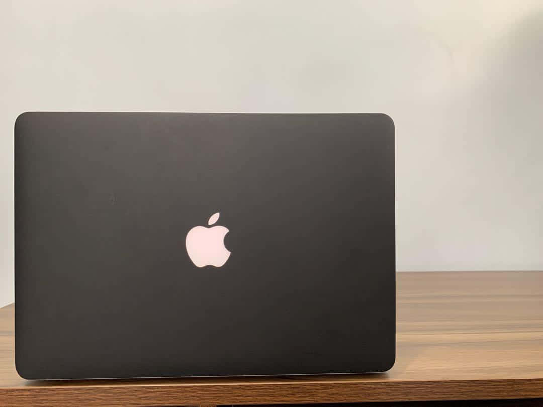 The Latest Black Macbook For More Efficient Computing Background