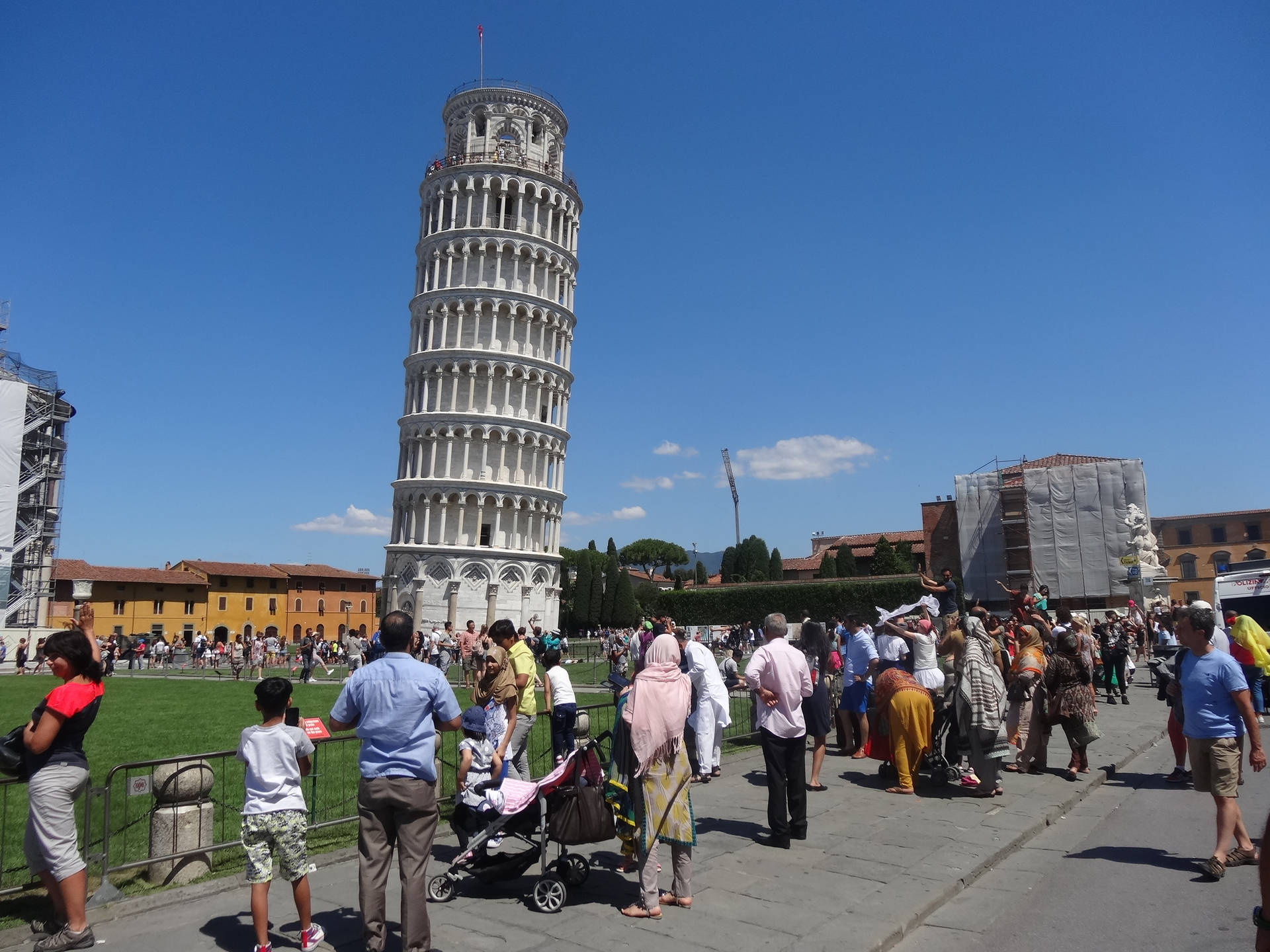 The Leaning Tower Of Pisa Tourists Background