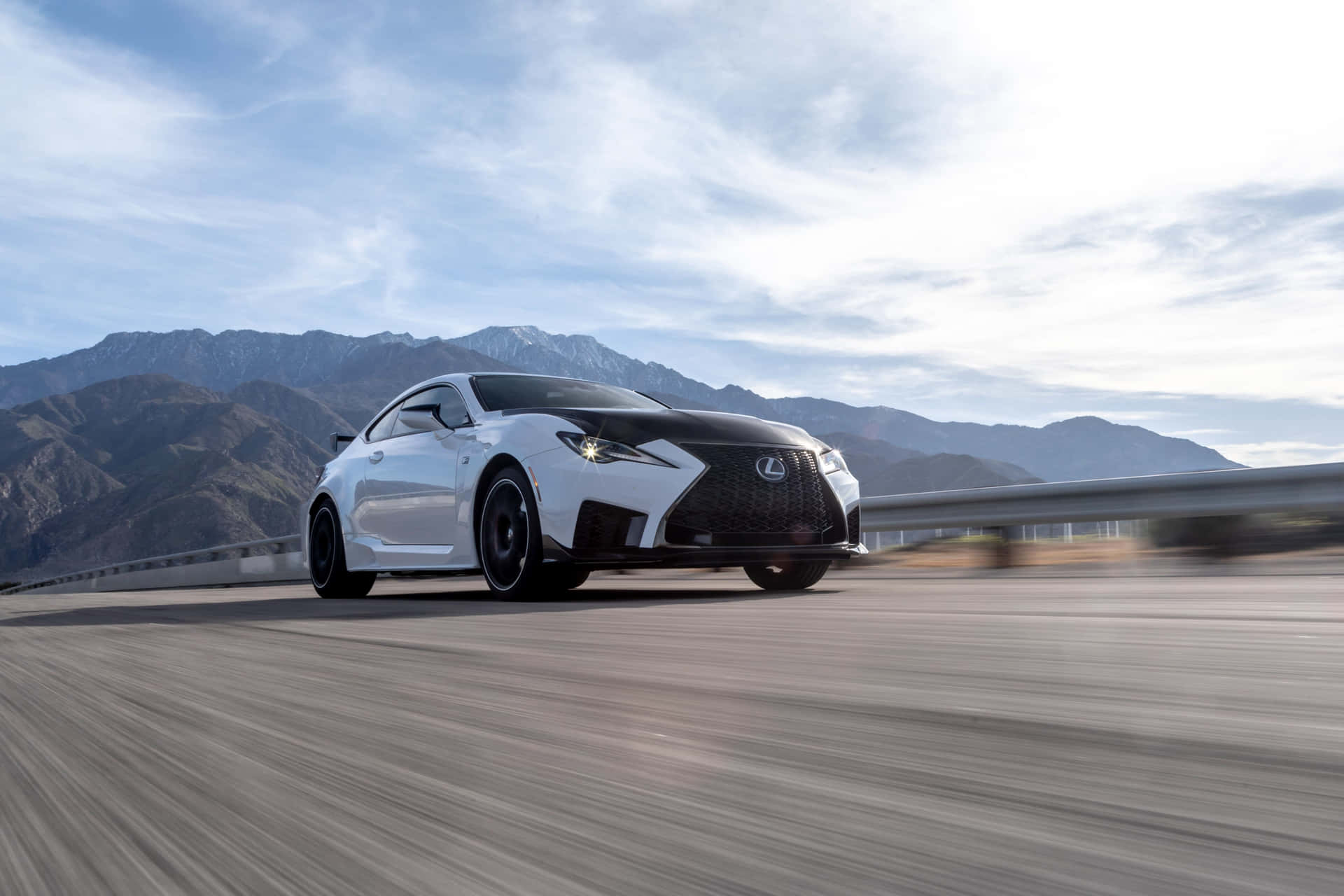The Lexus Rc F Sports Car Driving On A Mountain Road