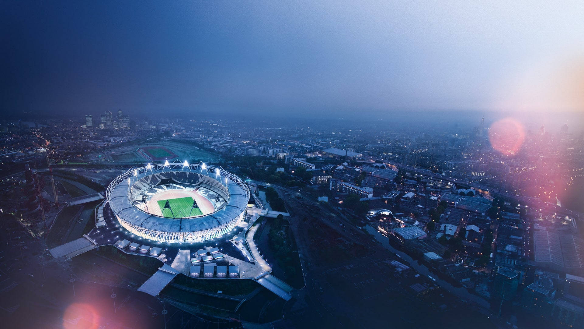 The Lights Come Alive As The Olympics Stadium Competes With The Stars Above