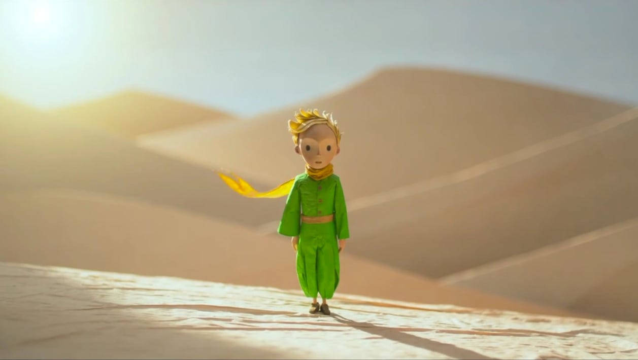 The Little Prince Standing On Sand Background