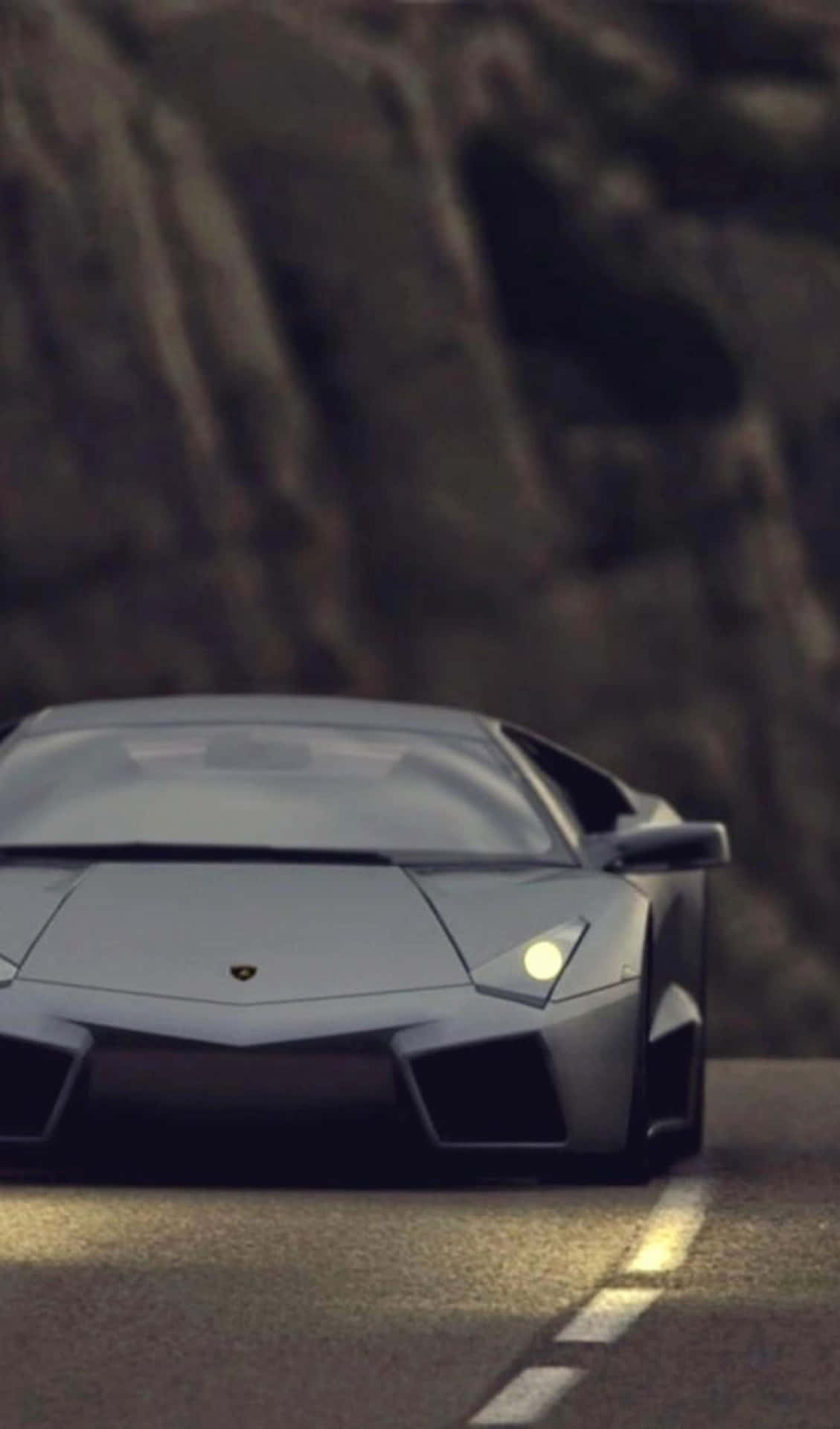 The Luxurious Black Lamborghini, A Symbol Of Status And Wealth Background
