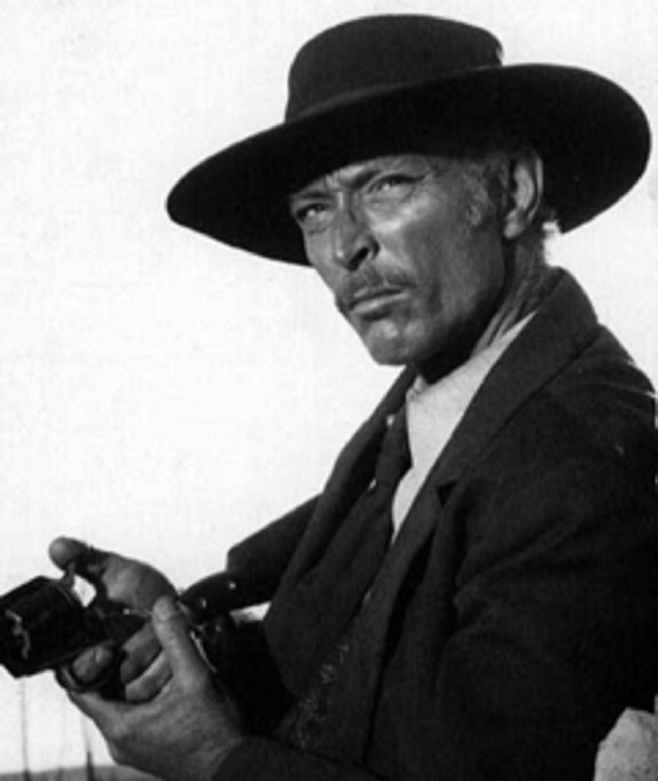 The Magnificent Persona Of Lee Van Cleef, As Col. Douglas Mortimer Background