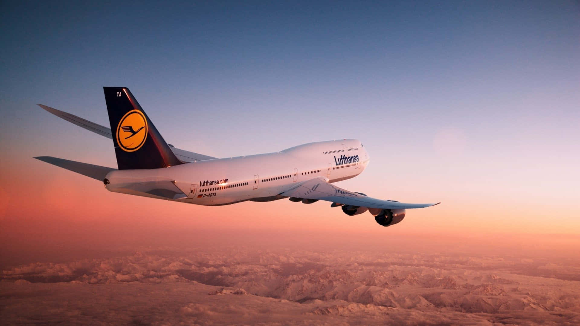 The Majestic 747 Airplane Soaring In The Skies