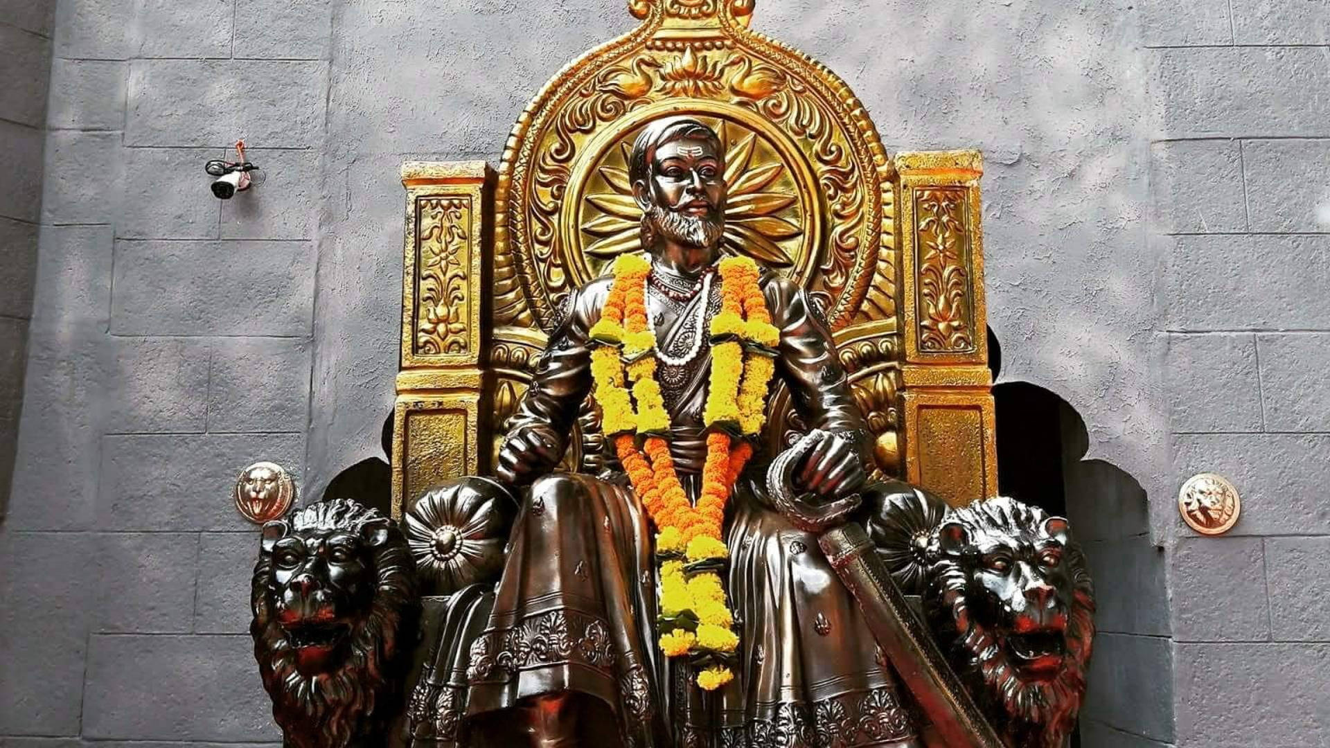 The Majestic Bronze Statue Of Chhatrapati Shivaji Maharaj Background