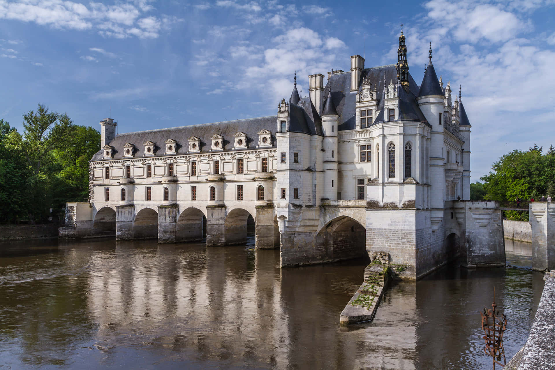 The Majestic Chenonceau Castle Over The Dark River Background