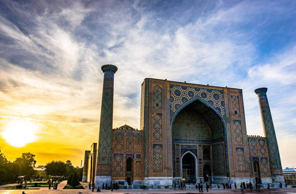 The Majestic Ulugh Beg Madrasah Under The Sunlight In Samarkand Background