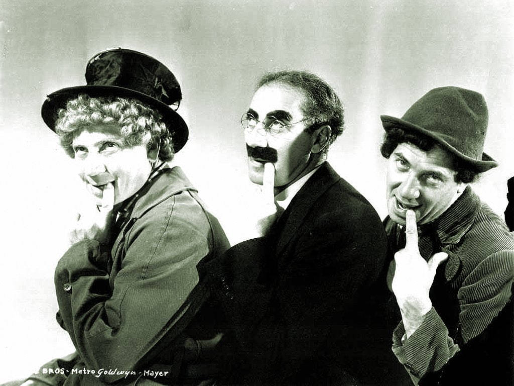 The Marx Brothers In A Playful Moment Background