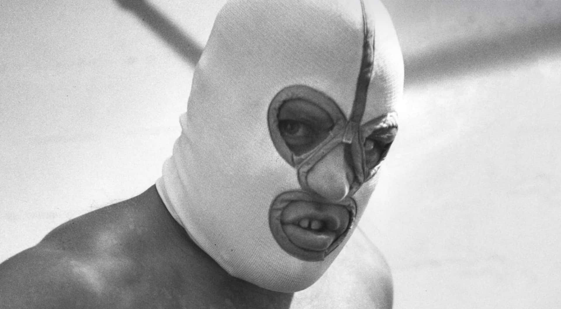 The Masked Destroyer In Action In Pro Wrestling Background