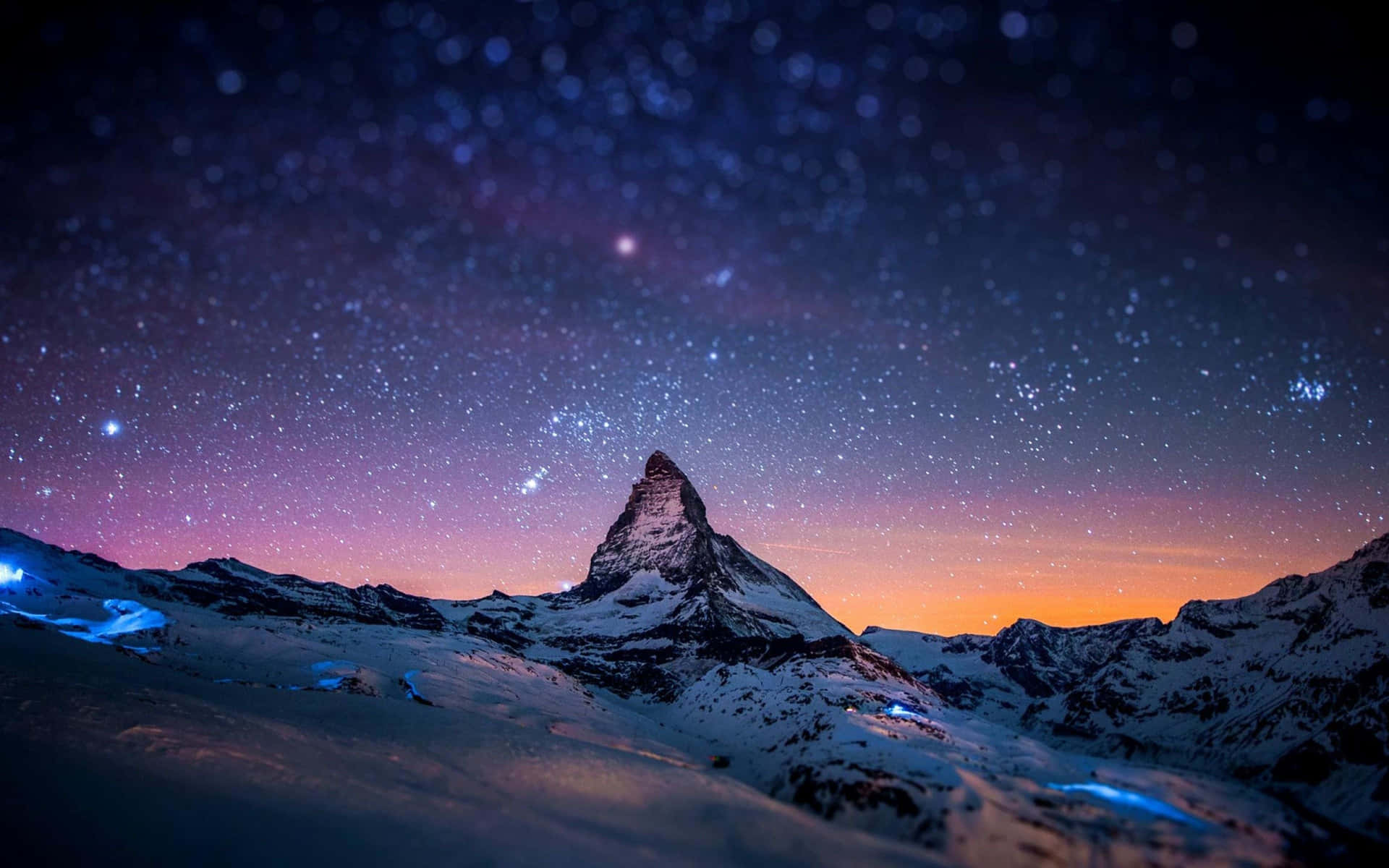 The Matterhorn At Night With Stars Above It Background