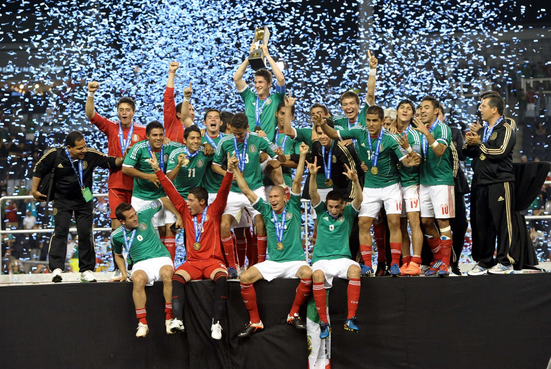 The Mexican National Soccer Team Proudly Poses For A Picture Before An International Match. Background