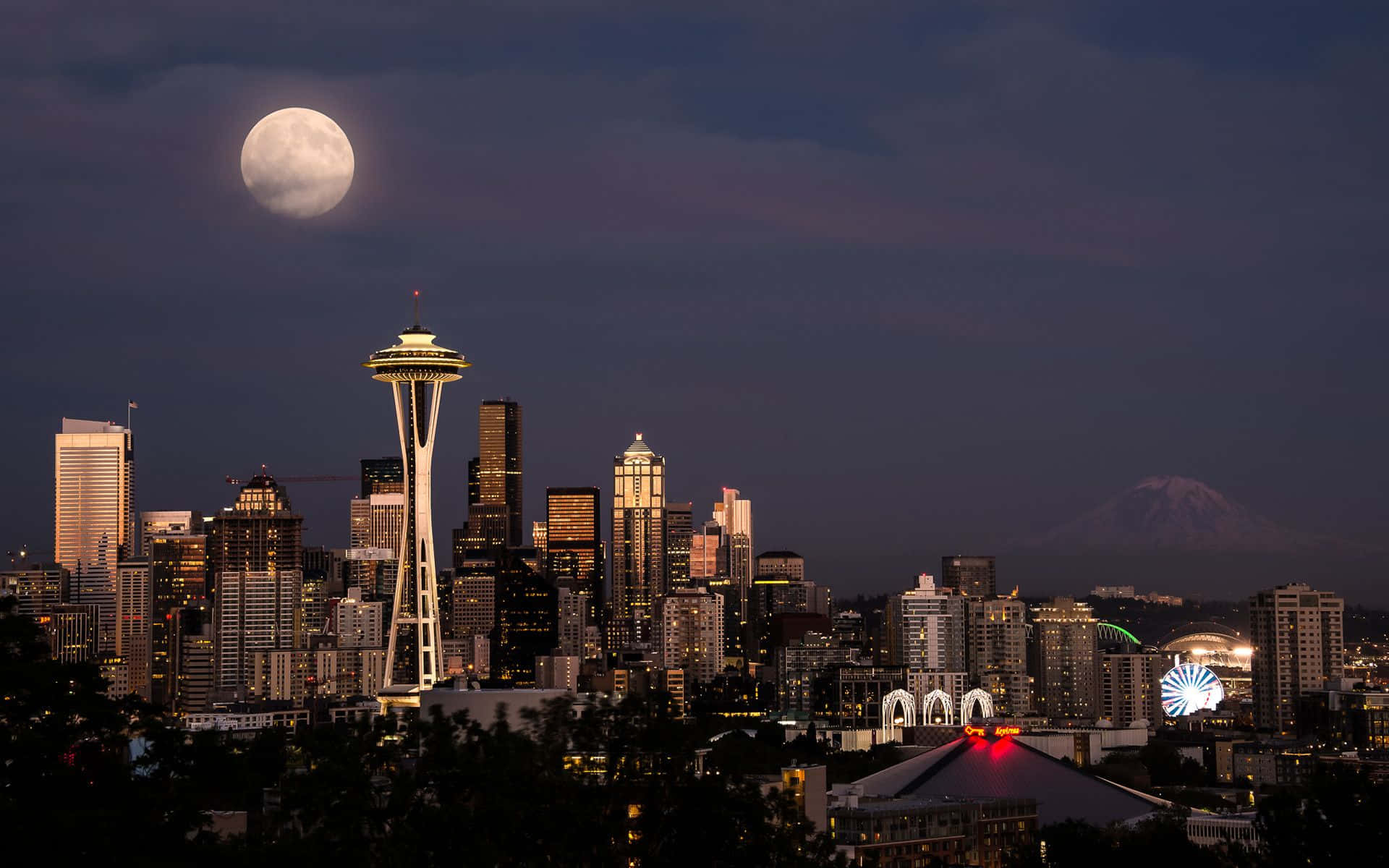 The Moon Is Seen Over The Seattle Skyline Background