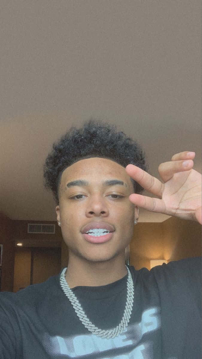 The Multi-talented R&b Singer Luh Kel Soars To The Top Background