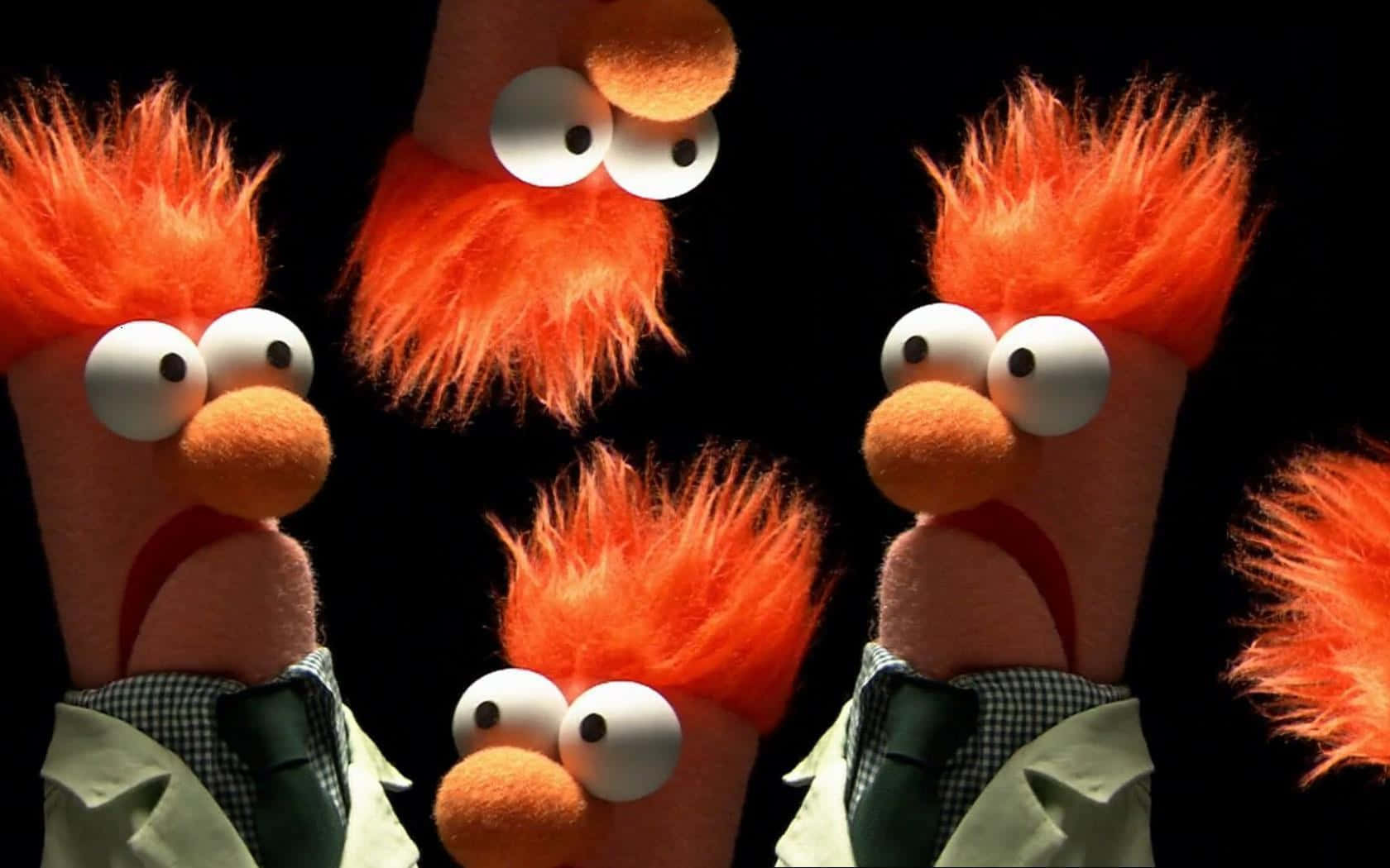 The Muppets - A Group Of Orange Stuffed Animals Background