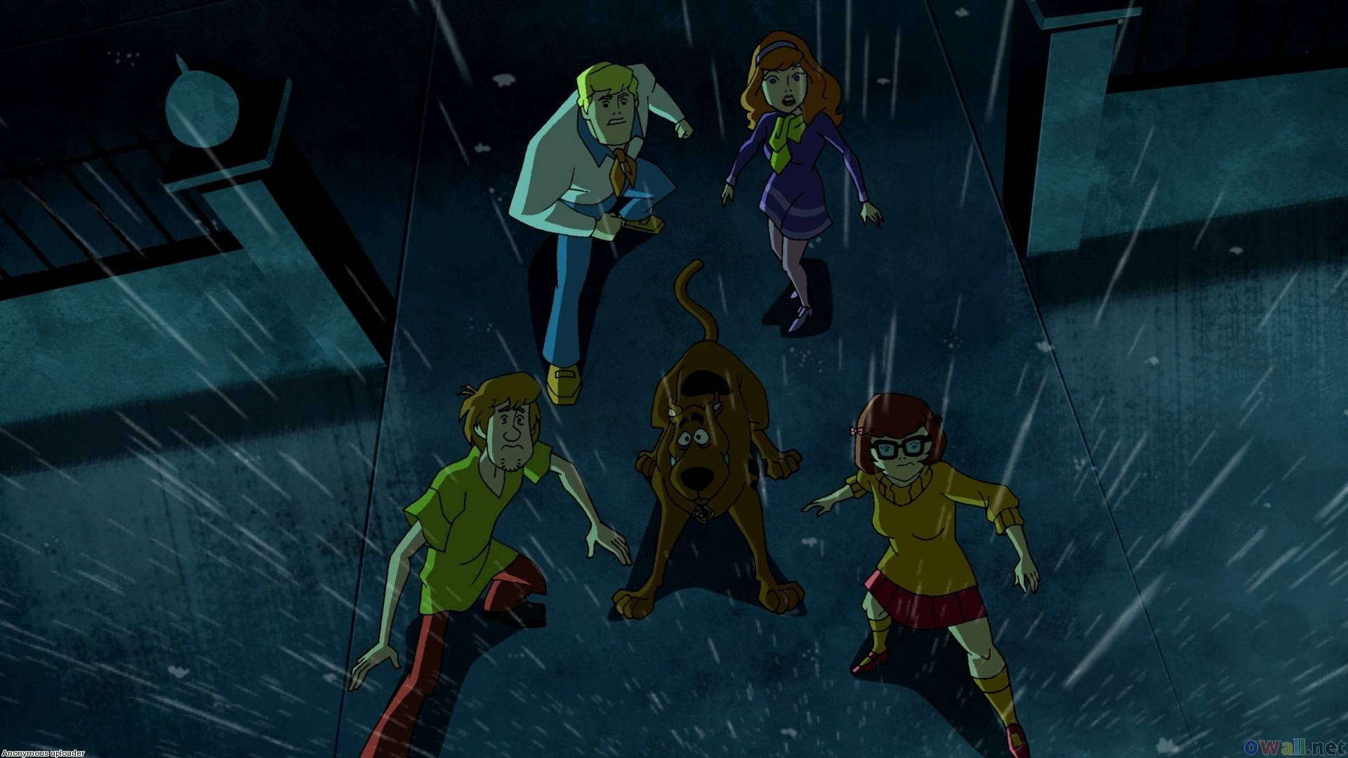 The Mystery Machine Driving Through A Deserted Road With Scooby Doo And The Gang