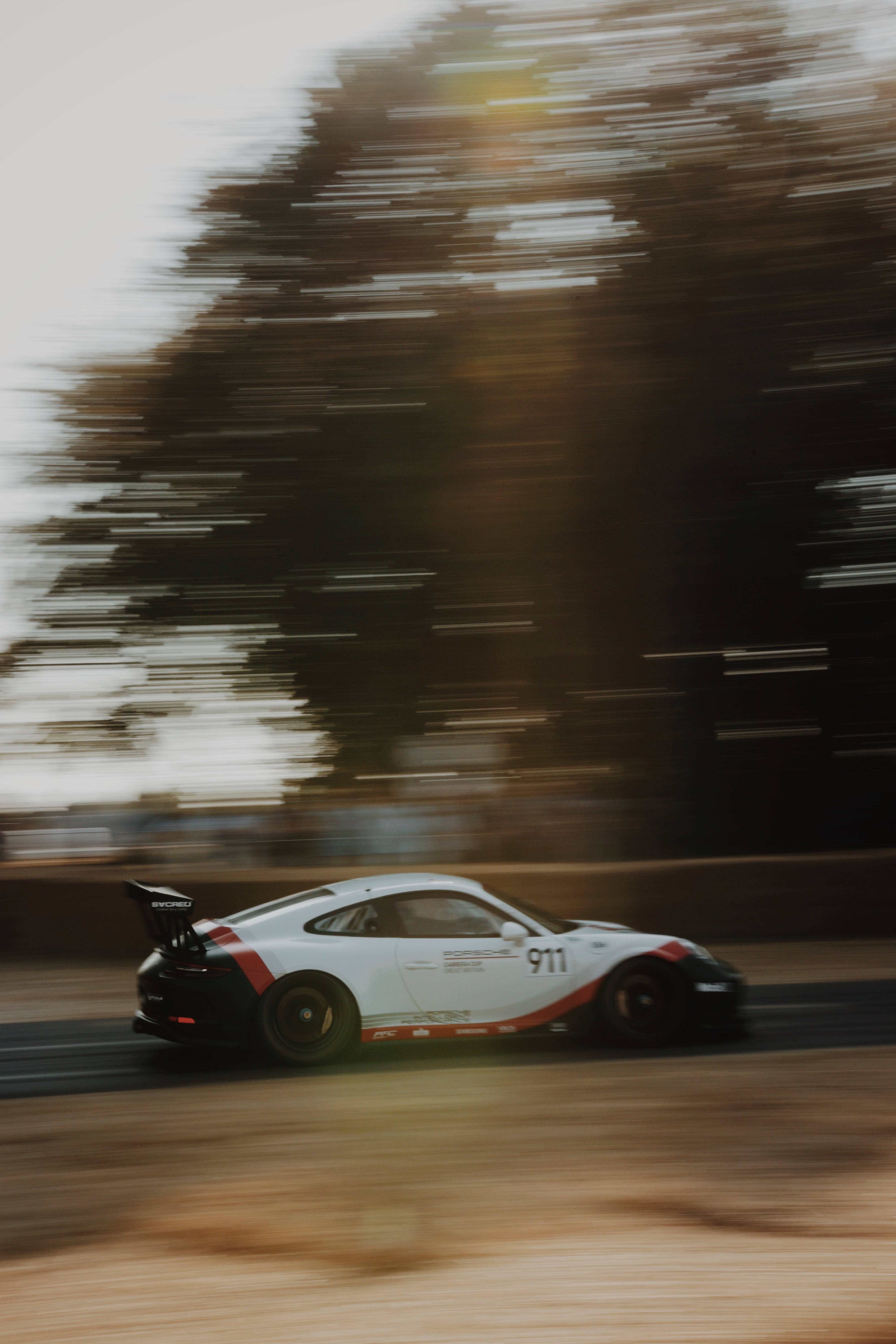 The Need For Speed – White Racecar In Action On Iphone Wallpaper Background