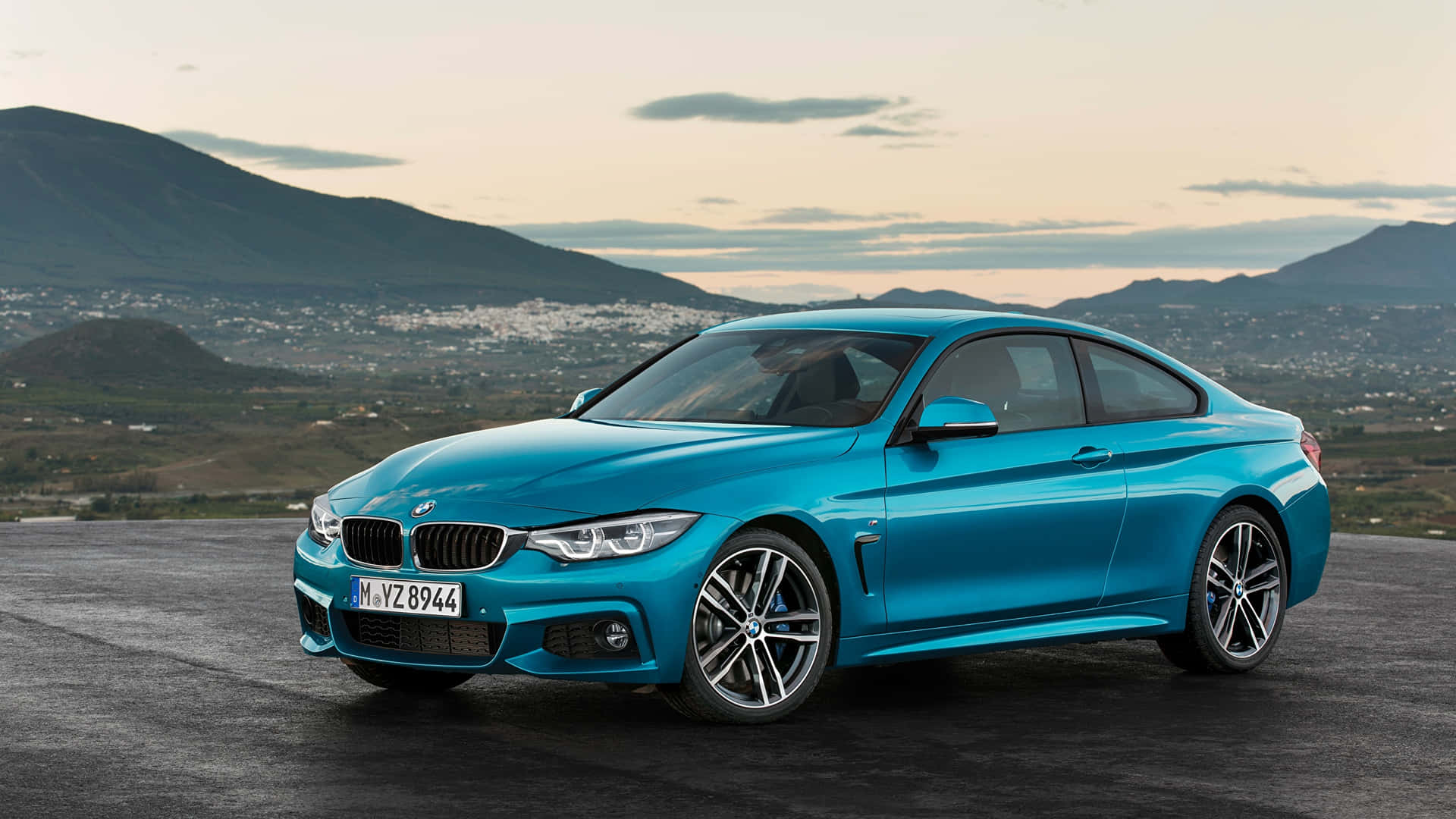 The New Bmw 4 Series Coupe Is Shown In Blue