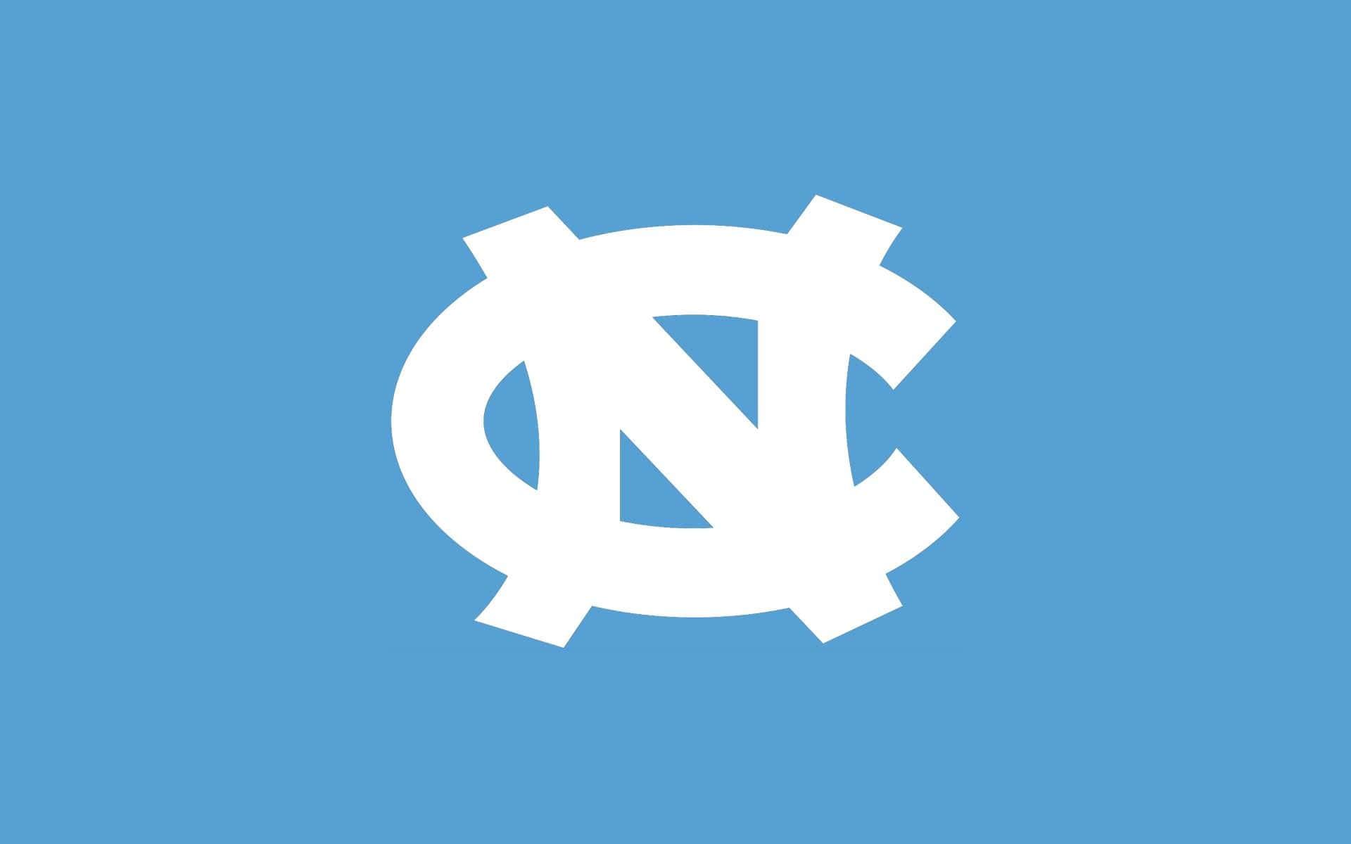 The North Carolina Tar Heels Logo On A Blue Background Background