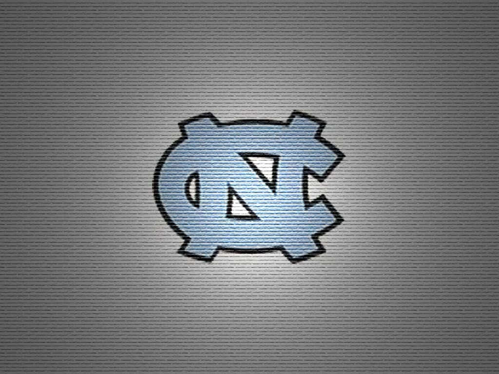 The North Carolina Tar Heels Logo On A Gray Background Background
