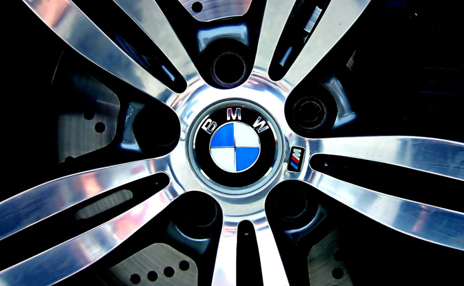 The Official Bmw Logo Against A Blue Background Background