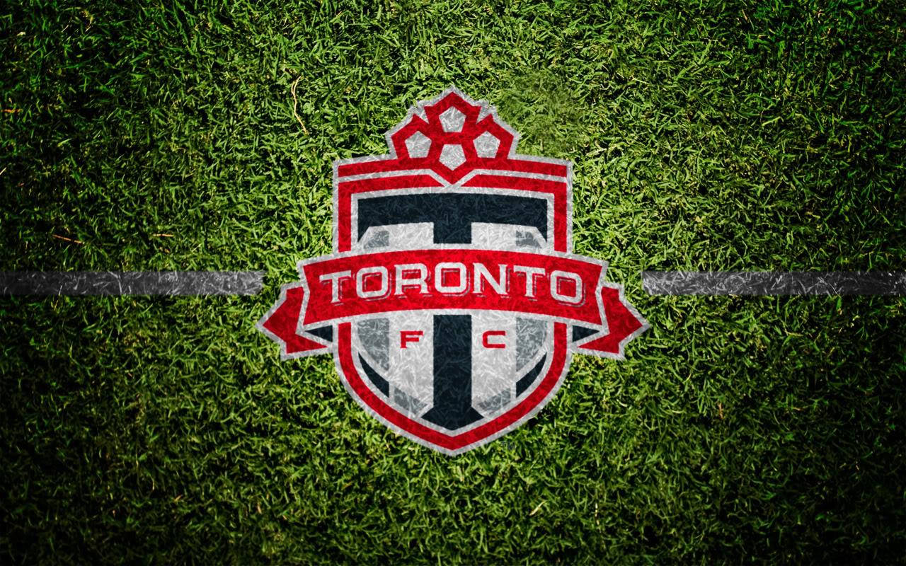 The Official Logo Of Toronto Fc Emblazoned In Vibrant Red.