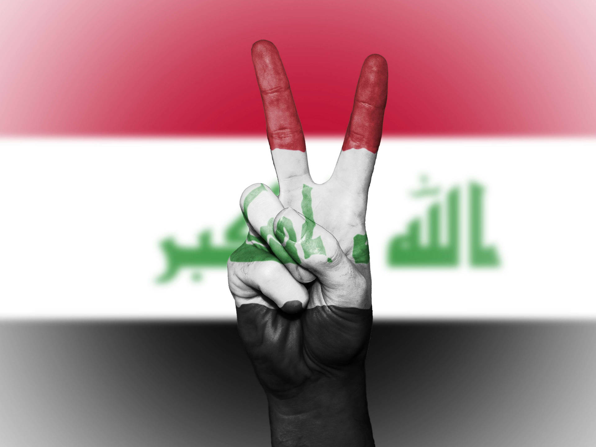 The Peaceful Power Of Iraq - A Hand Symbolizing Peace Covered With An Iraqi Flag. Background