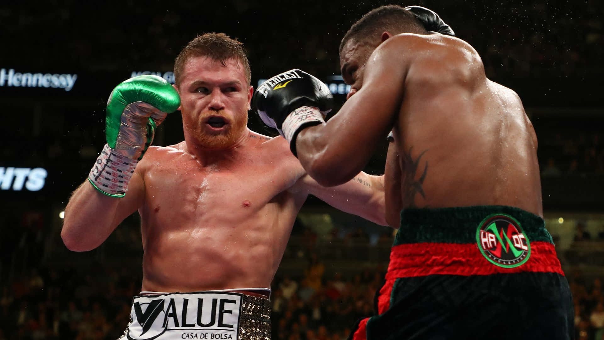 The Power-packed Punch: Saul Canelo Alvarez In Action Background