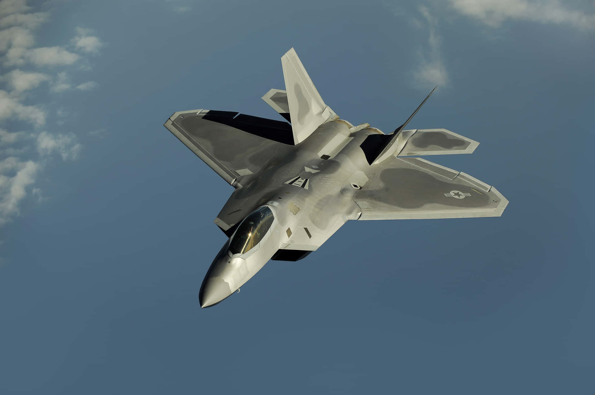 The Powerful F-22 Raptor Flying High Background