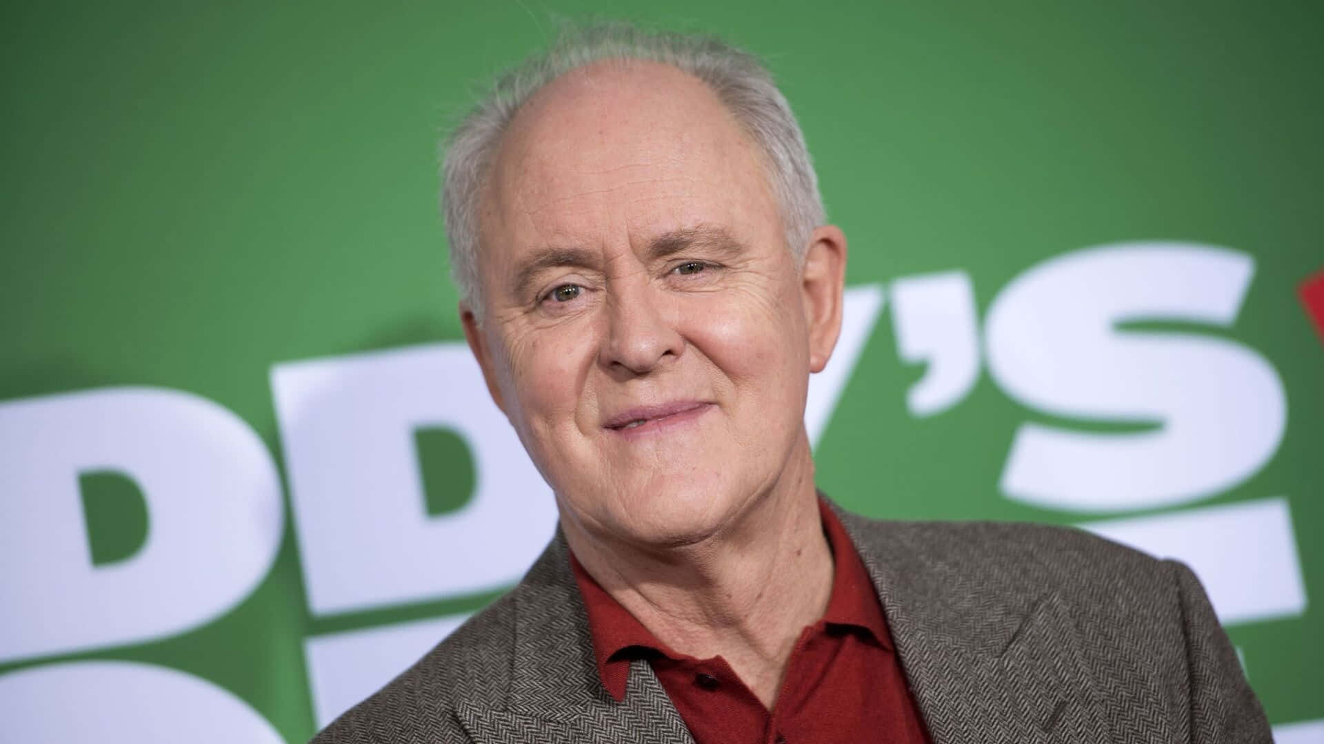 The Prolific Actor John Lithgow In A Thoughtful Pose Background